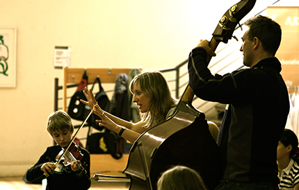 Gillian conducting musicians